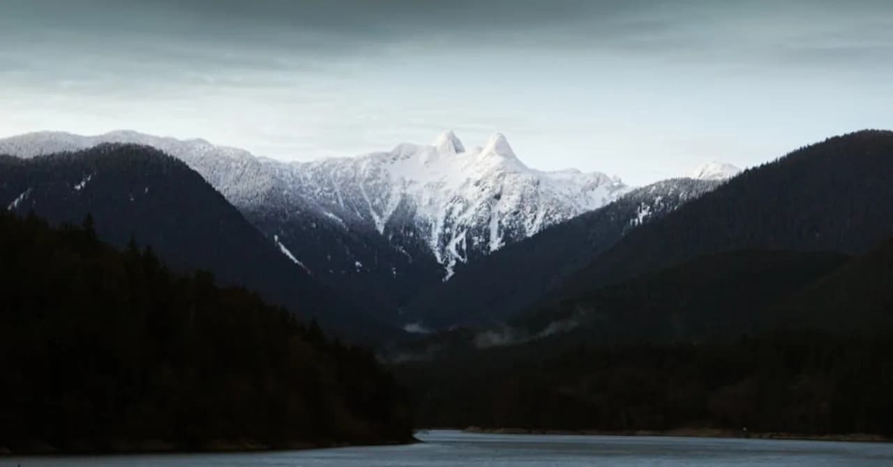 Vancouver in winter — coastal mountains and harbour, mild snow — Canada.