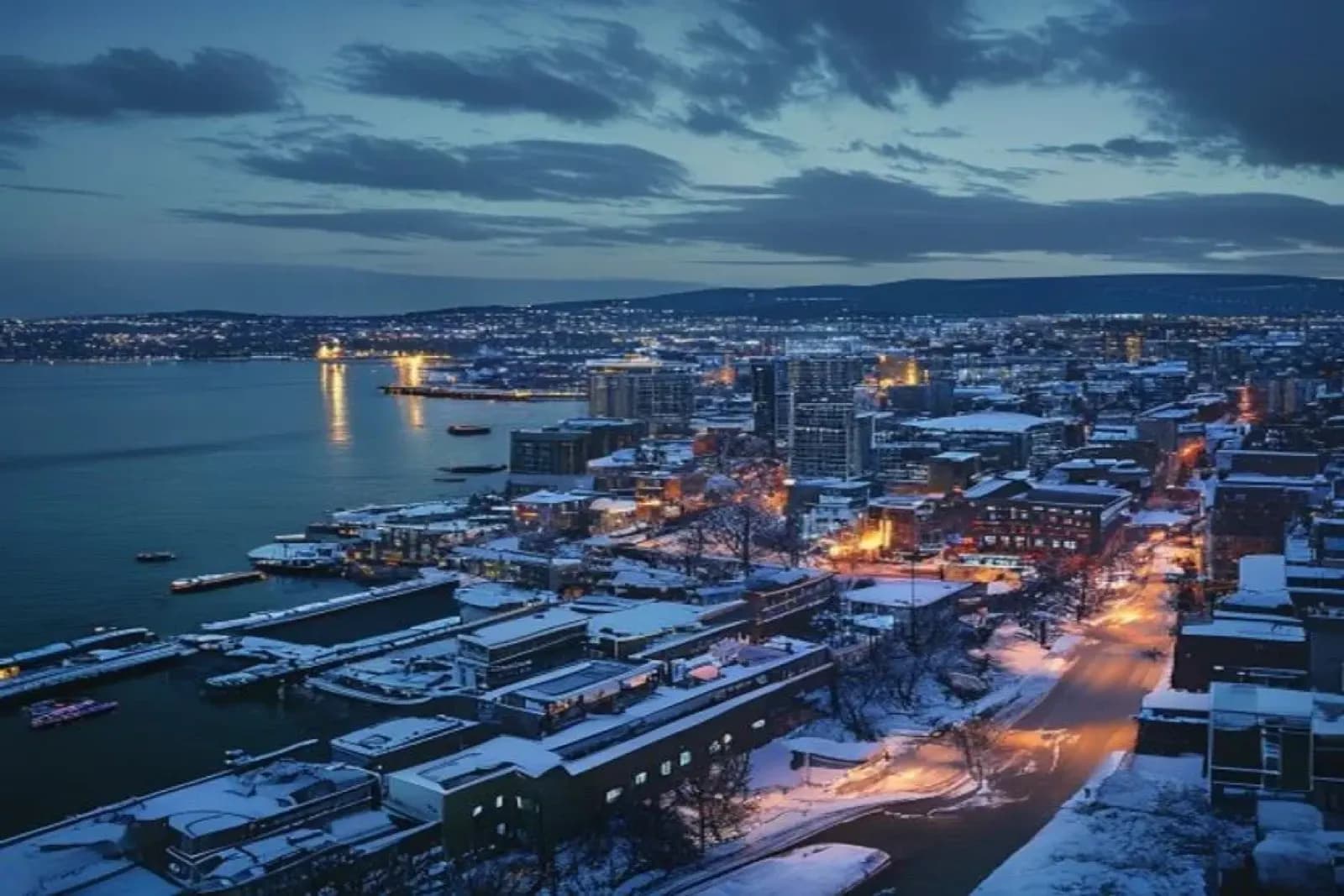 Thunder Bay, ON — Lake Superior port city in deep winter, heavy lake-effect snowpack on commercial and industrial properties, snow.ca service area — Canada.