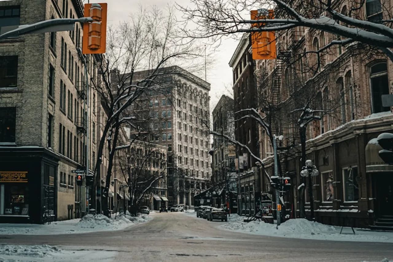 Winnipeg in winter — Forks skating trail and downtown under deep cold — Canada.